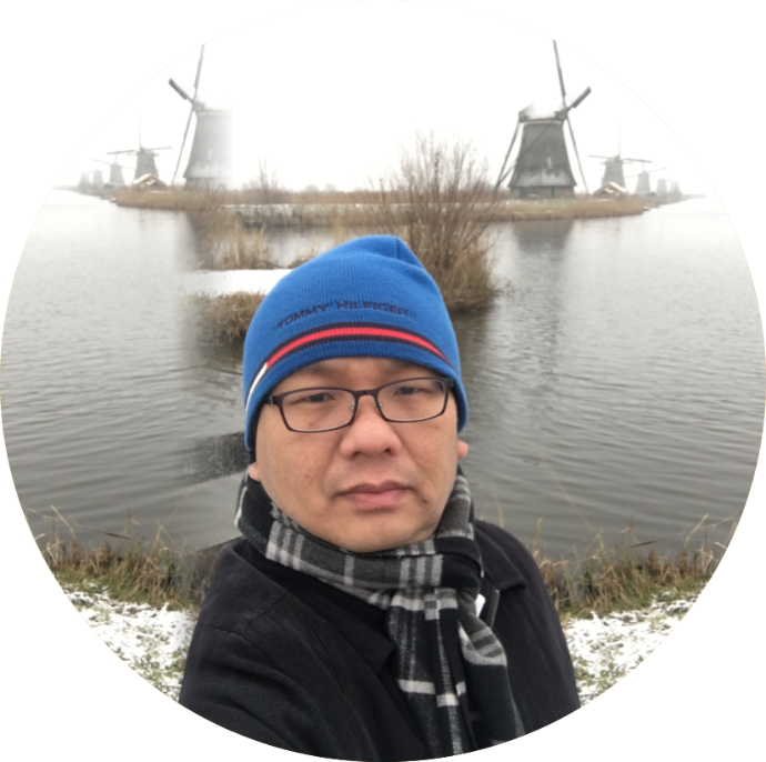 Daniel Kek , Chinese boss in front of river/sea & freezing temperatures